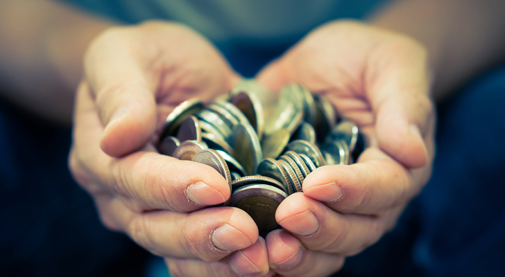 Mønter i hånd som kompensation 